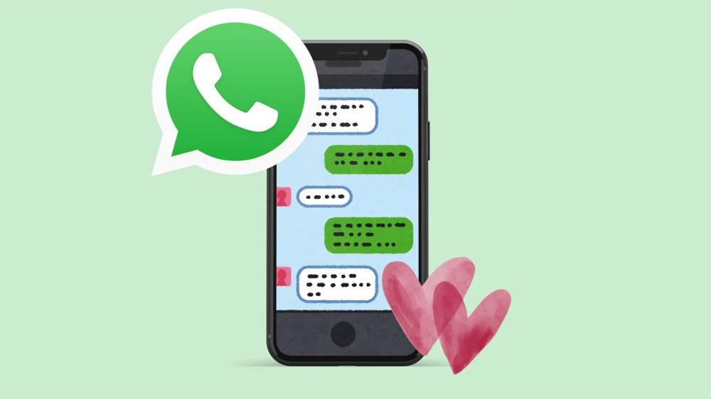 Pantalla de smartphone mostrando chat de WhatsApp personalizado con fondo romántico de corazones rojos y rosados para San Valentín