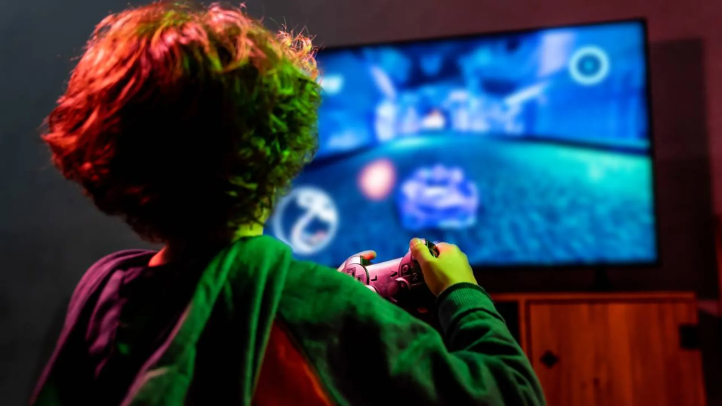 oven preocupado mirando su teléfono móvil con iconos de videojuegos y redes sociales flotando a su alrededor.