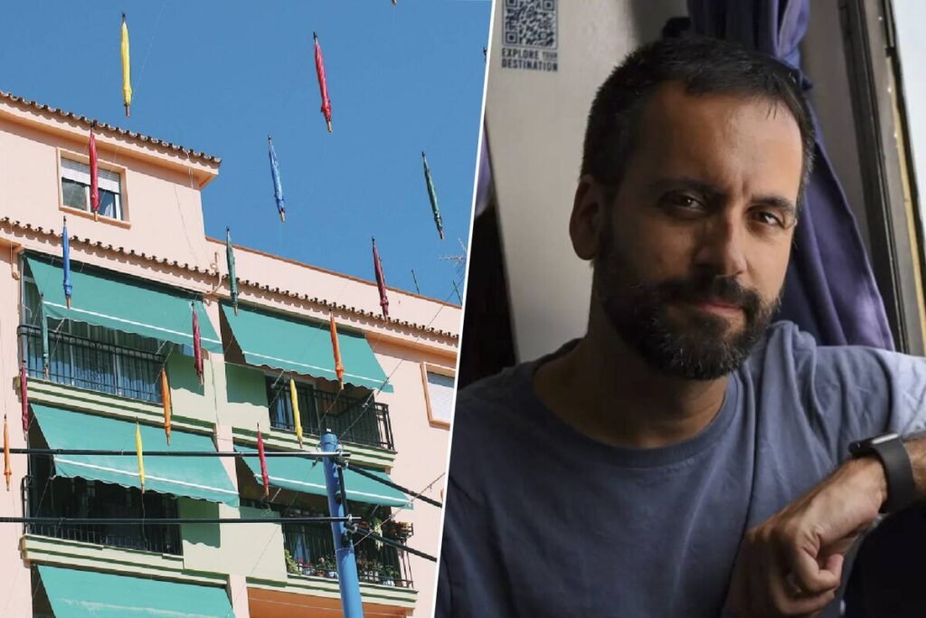 Fachada de un edificio residencial con un toldo verde oscuro en la ventana desplegado para bloquear la radiación solar.