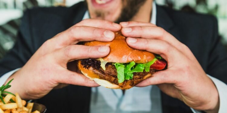 Representación gráfica de hamburguesas saludables creadas con inteligencia artificial, junto a datos nutricionales y elementos tecnológicos.