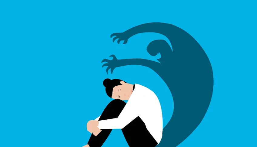 Joven reflexionando en un entorno tranquilo, representando las dificultades para comprender y medir los problemas de salud mental