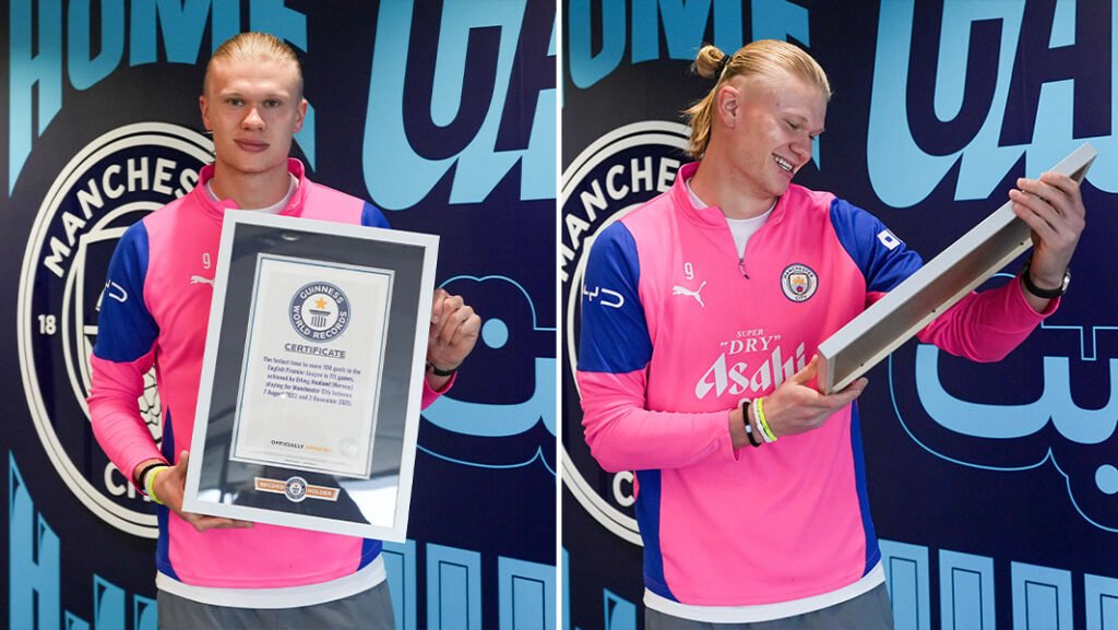 El delantero noruego sosteniendo sus reconocimientos oficiales de Erling Haaland en los Guinness World Records.