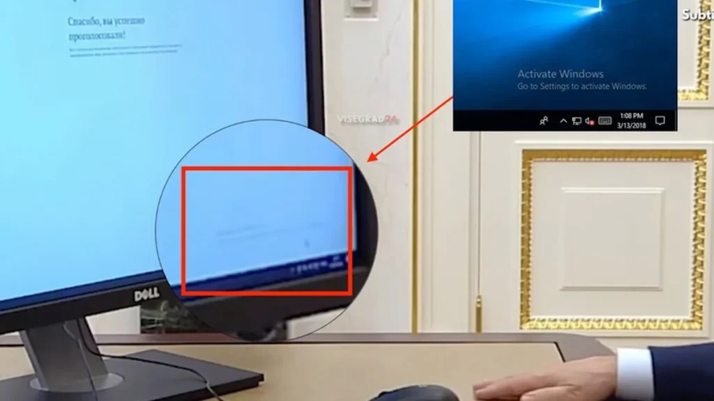 Monitor oficial con mensaje de activación de Microsoft Windows en entorno de trabajo