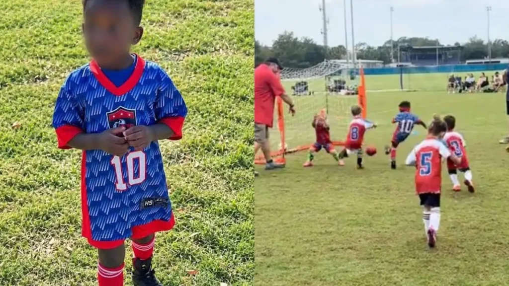 Balón sobre el césped de una cancha de fútbol infantil durante un entrenamiento