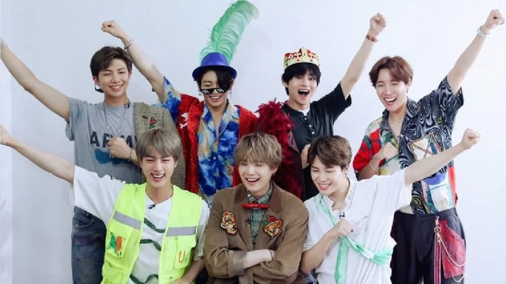 Integrantes de la banda surcoreana BTS en un concierto masivo ante miles de seguidores
