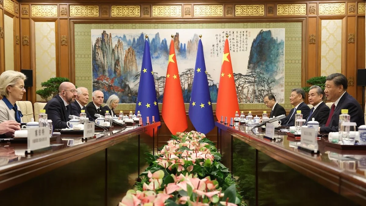 Banderas de la Unión Europea y de la República Popular China en mesa de negociación